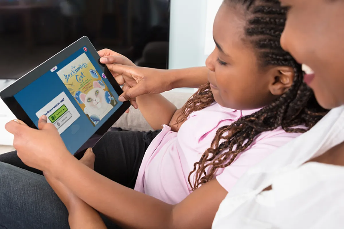 Parent and child using Skybrary together on a tablet