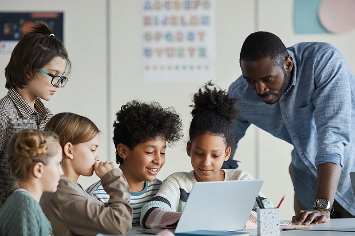 Image of teacher interacting with students