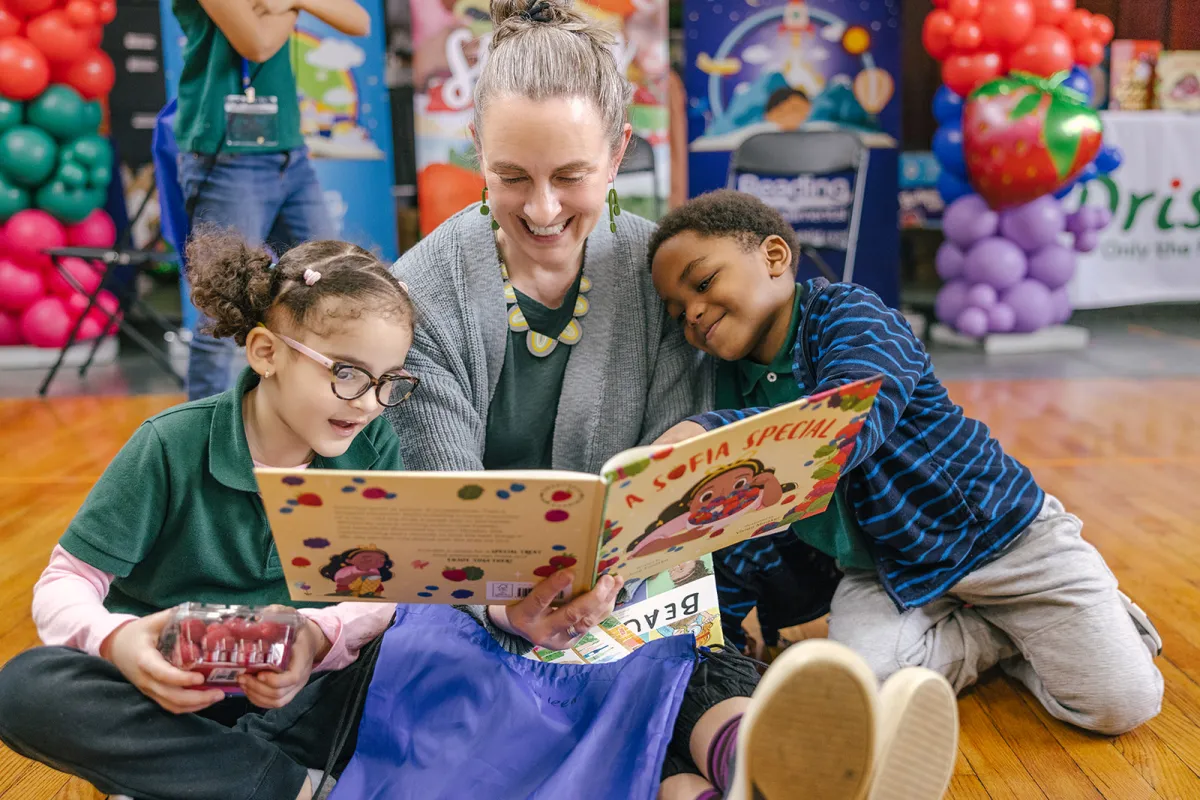 teacher reading books with kids