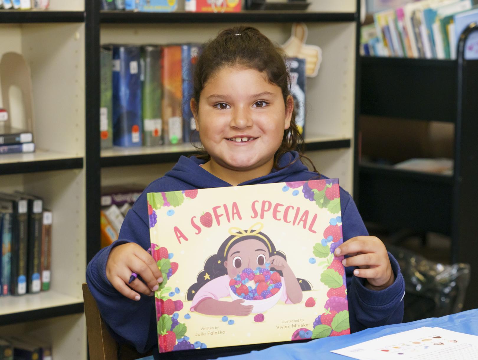 Girl smiling with book
