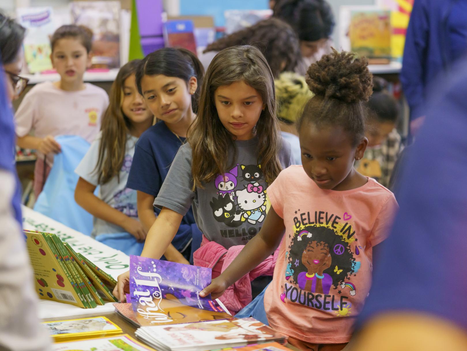 Girls choosing books