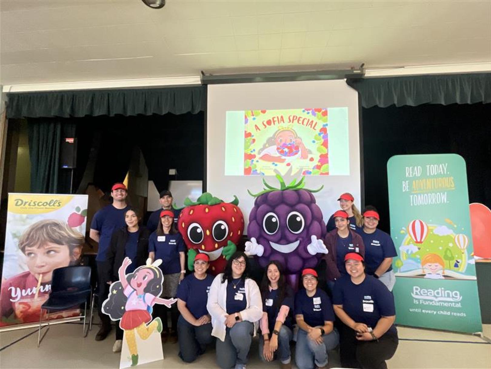 Driscoll's and RIF volunteers posing for photo with mascots