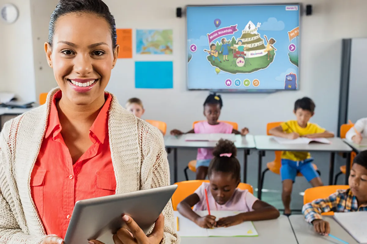 Image of teacher smiling with Skybrary in the background